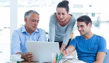 Team of 3 Viewing Laptop