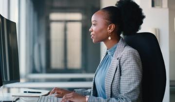 Woman Working in Office on Computer