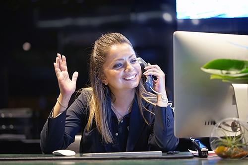 Receptionist at Desk on Phone