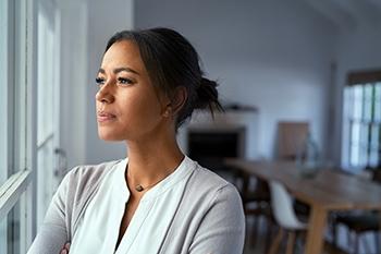 Woman Looking Out Window