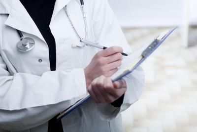 Doctor Writing on Clipboard