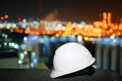 safety hard hat and lights in background