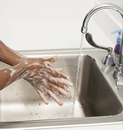 Washing Hands with Soap in Sink