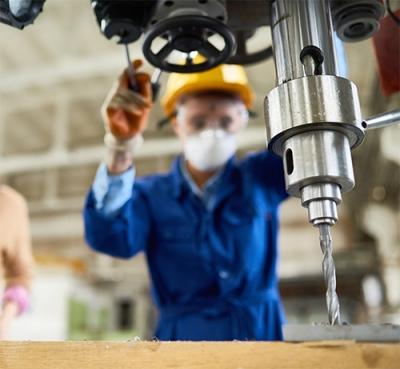 Man using Drill Press