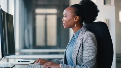 Woman Working in Office on Computer